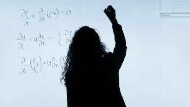 woman writing on a whiteboard