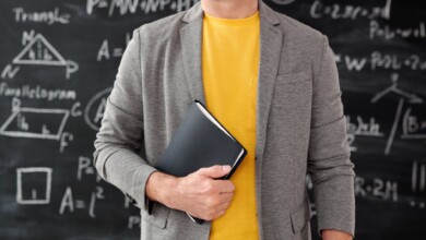 unrecognizable person holding a notebook