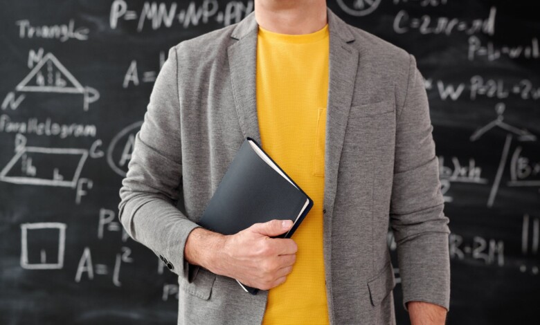 unrecognizable person holding a notebook