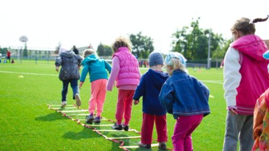 children s team building on green grassland