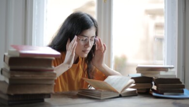 a weary female student having a headache