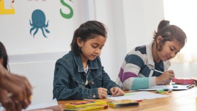 two girls doing school works