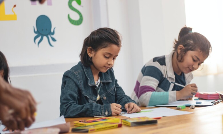 two girls doing school works