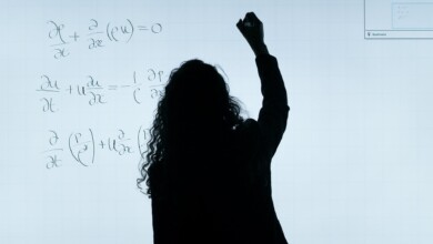 woman writing on a whiteboard