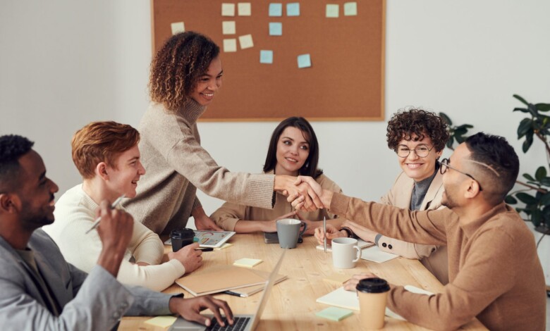 colleagues shaking each other s hands