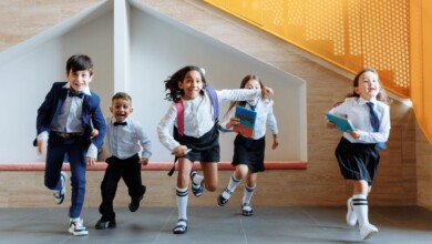 students running together inside the school