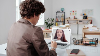 a man using laptop during online class