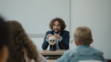teacher showing his class a human skull
