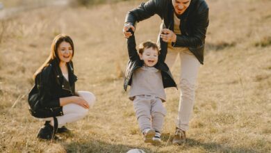 photo of family having fun with soccer ball
