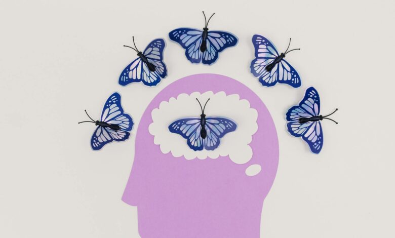 illustration of a head and butterflies around the scalp and inside the brain