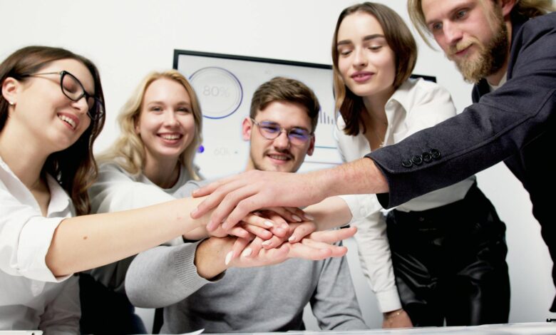 a group of people huddle during a meeting