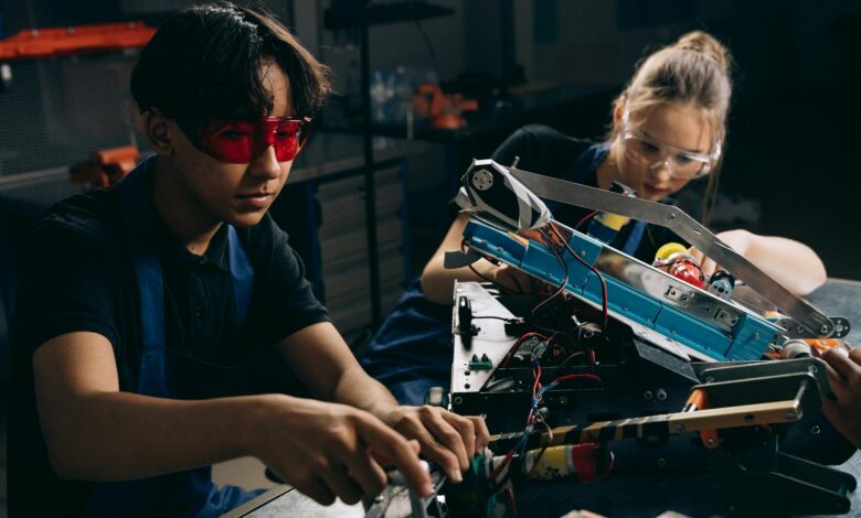 electric engineers working on a machine