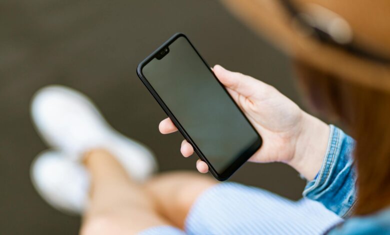 person holding black smartphone