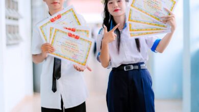 students celebrating achievements in school hallway