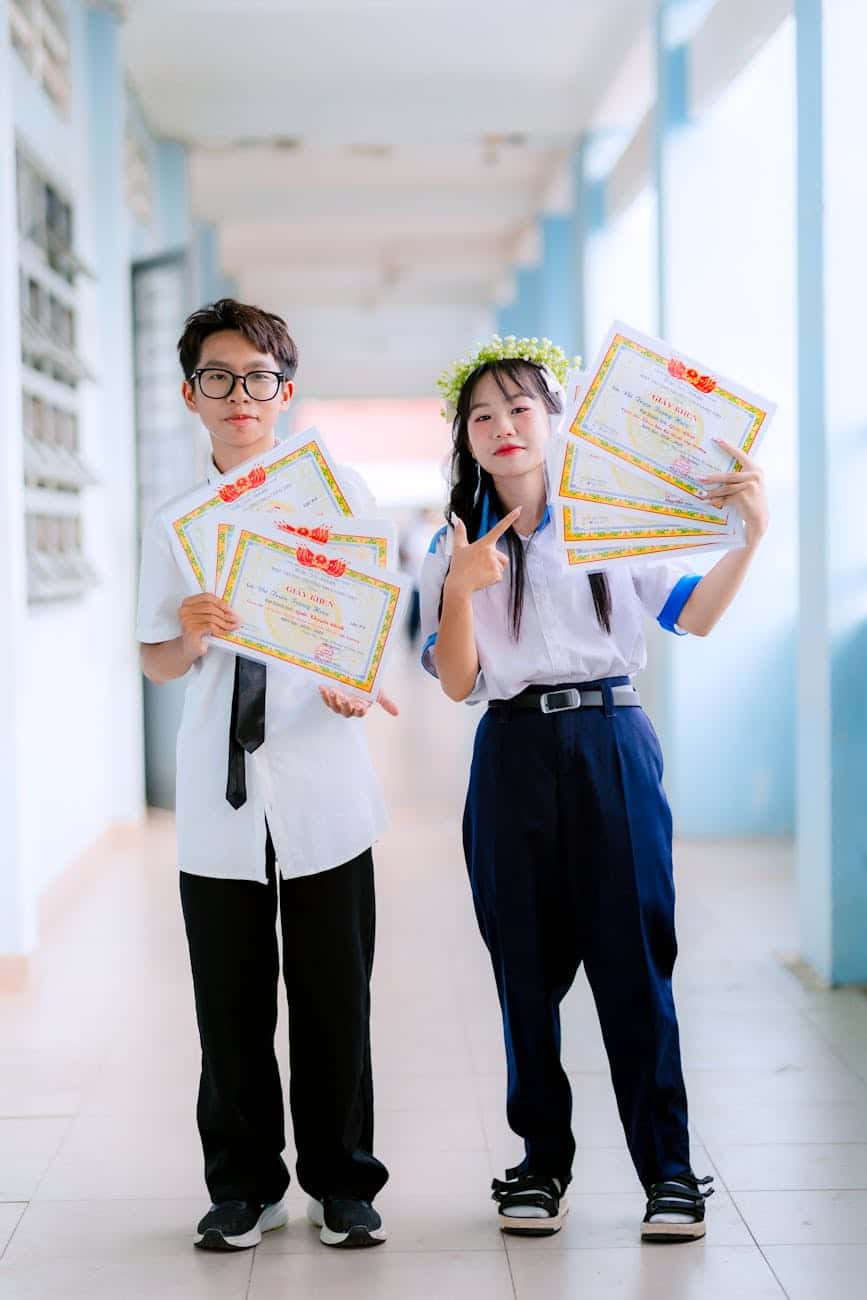 students celebrating achievements in school hallway