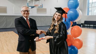 photo of happy woman in graduation gown