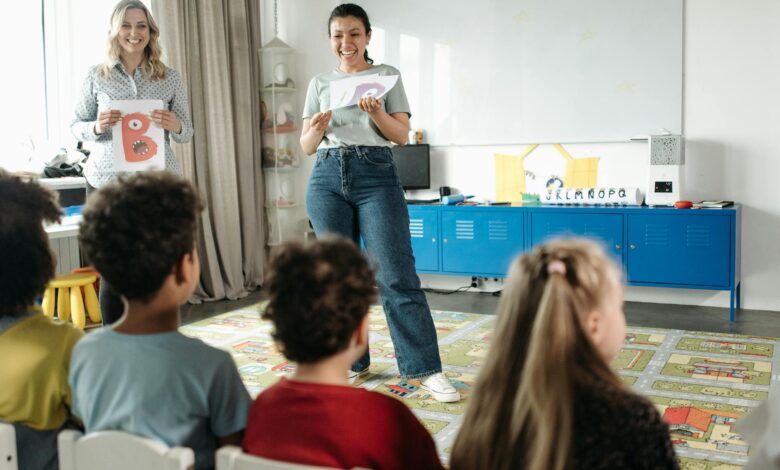 woman in white shirt standing in front of people