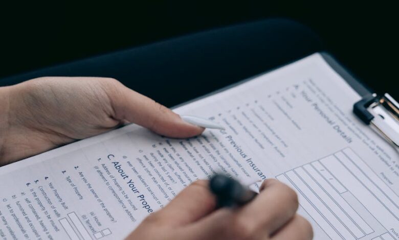 man signing documents