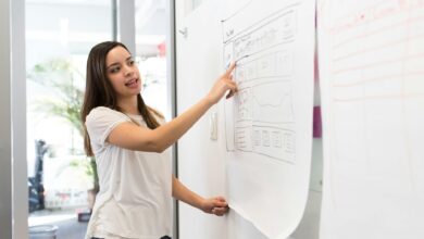 photo of woman pointing on white paper