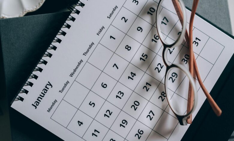 brown framed eyeglasses on a calendar