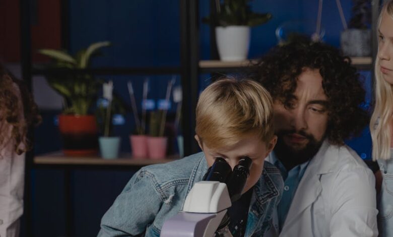 student looking at a microscope