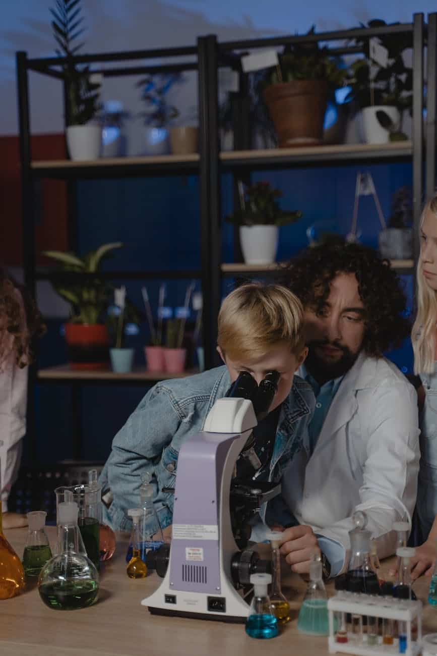 student looking at a microscope