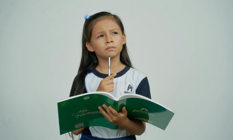 pensive girl with school notebook thinking