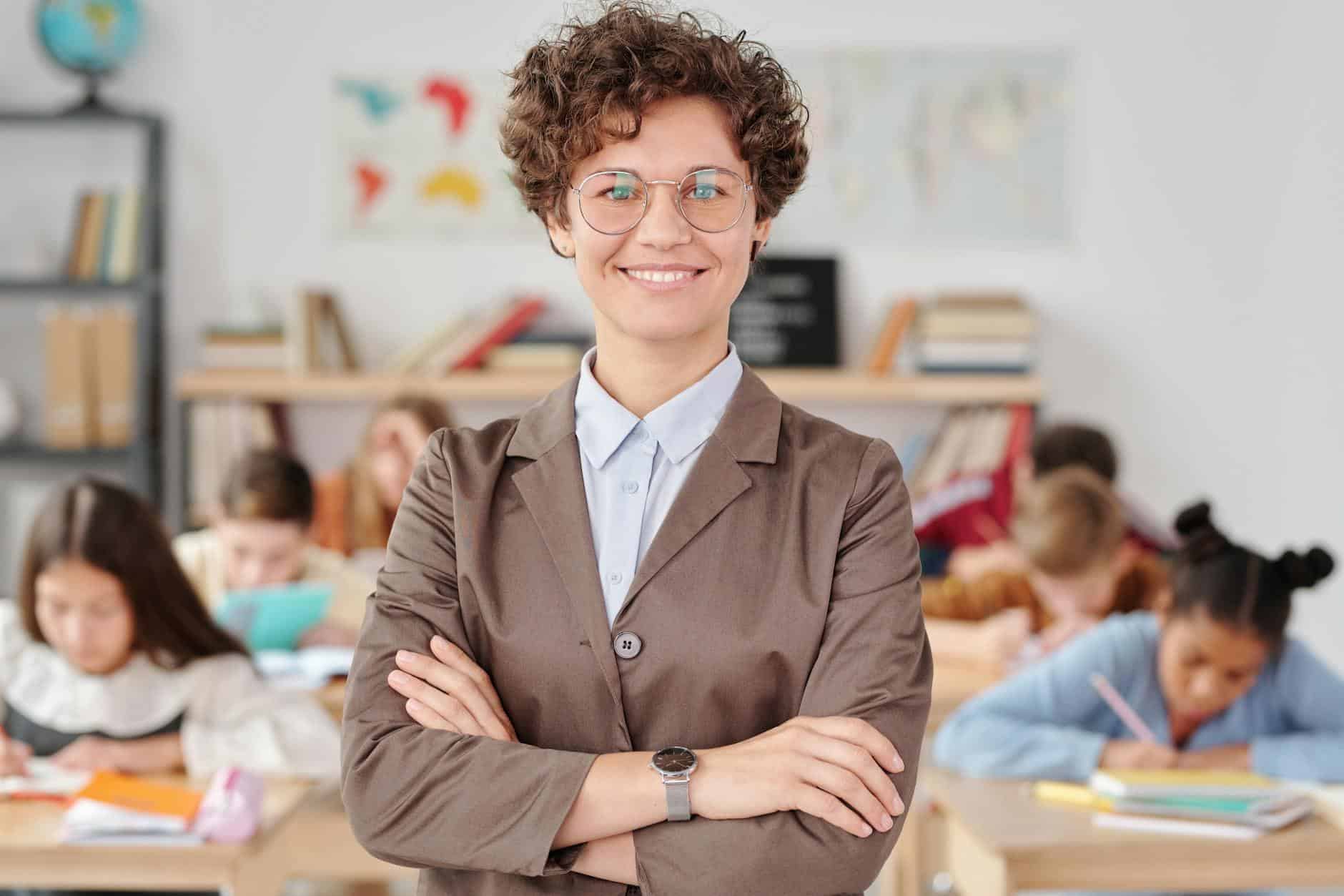 a woman wearing eyeglasses doing arms crossed