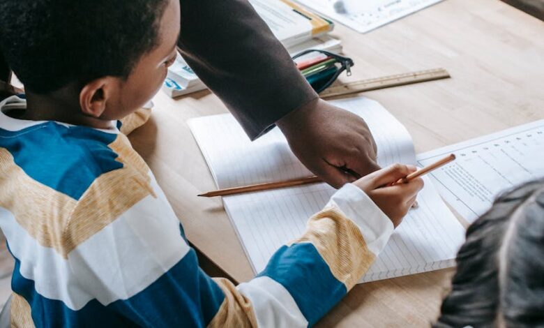 smart kids studying with teacher in classroom