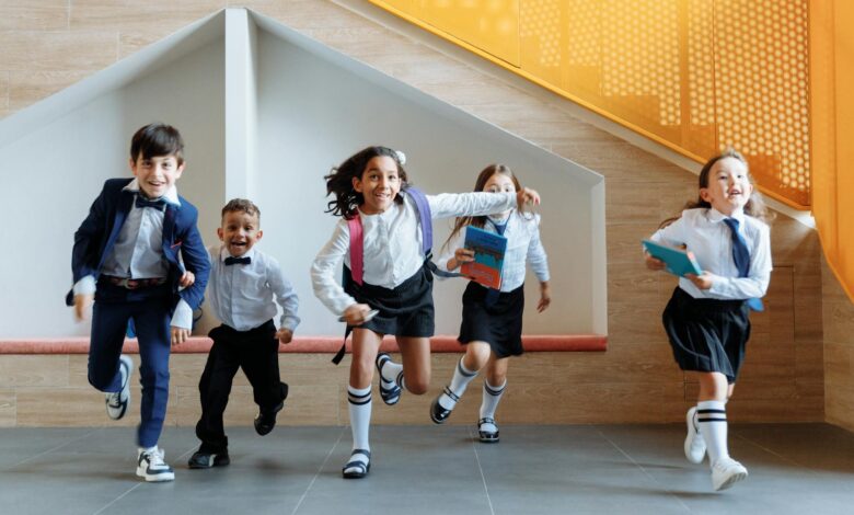 students running together inside the school