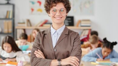 a woman wearing eyeglasses doing arms crossed