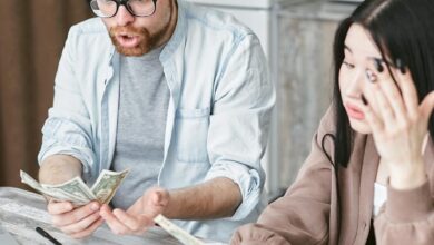 man and woman holding a money