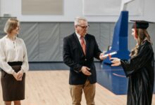 photo of woman receives her diploma