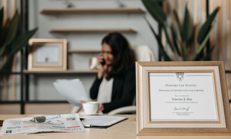 selective focus photo of a diploma on a frame