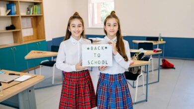 twins holding a letter board