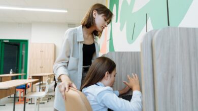 a teacher helping her student