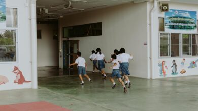 a group of students running inside the school