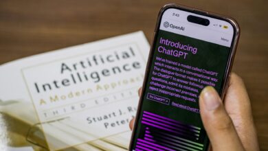 close up of a person holding a smartphone displaying chatgpt