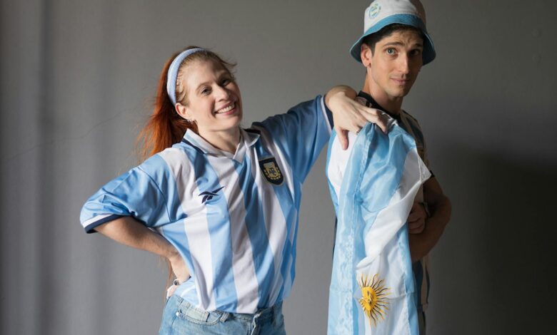 argentinian fans celebrating in flag attire