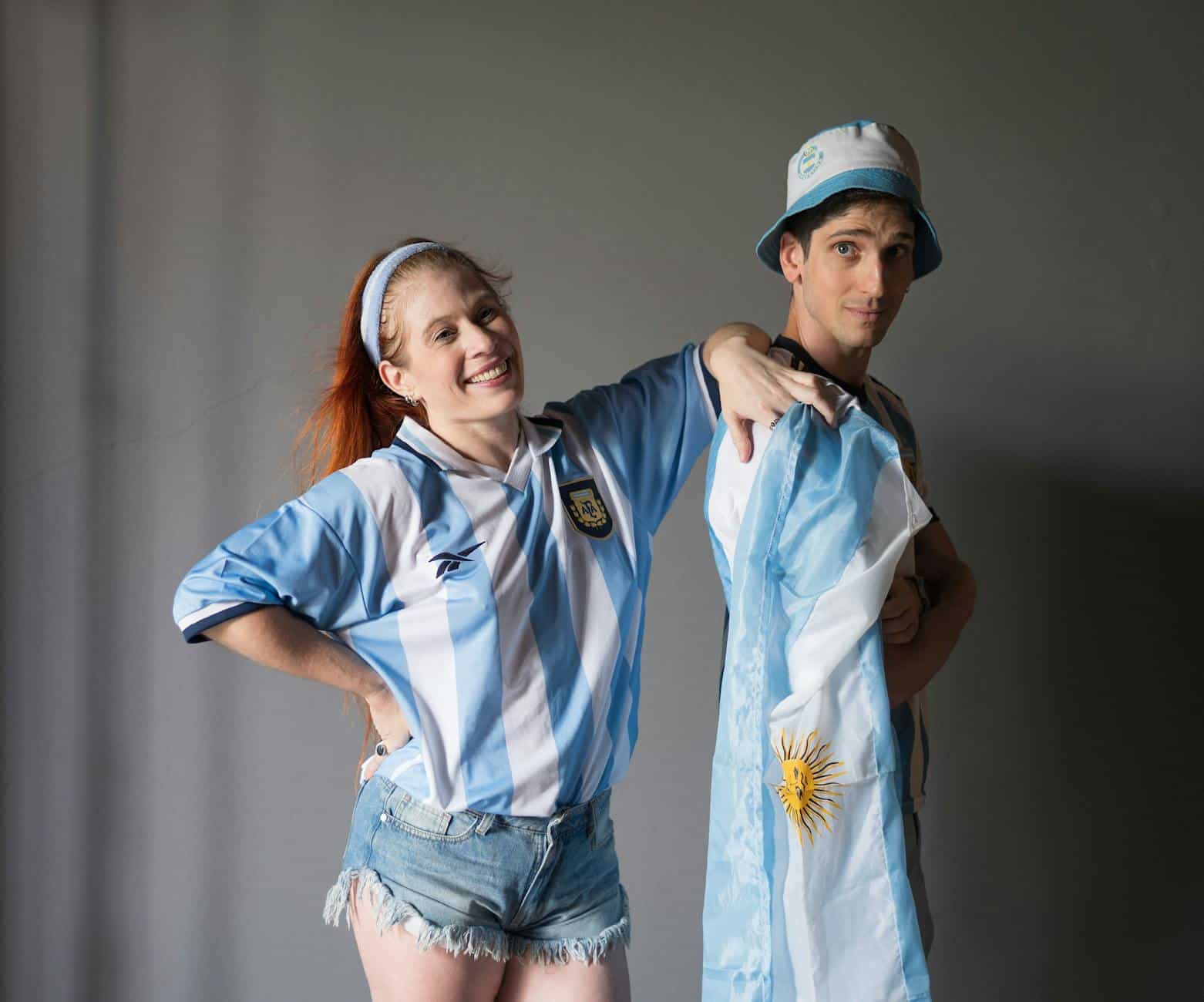 argentinian fans celebrating in flag attire
