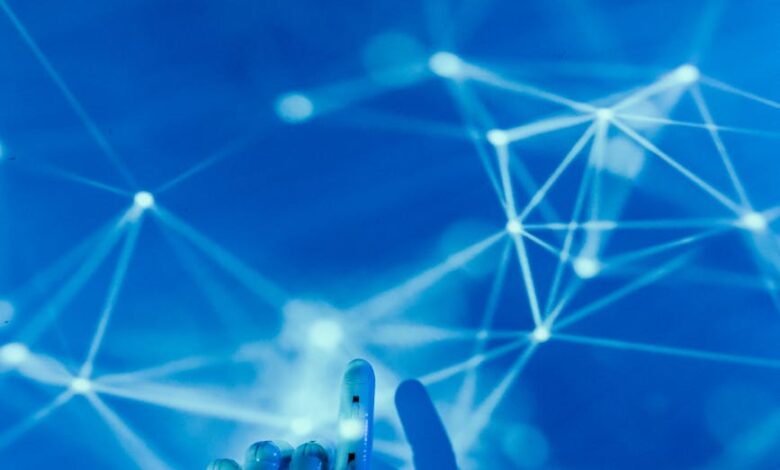 robot s hand on a blue background