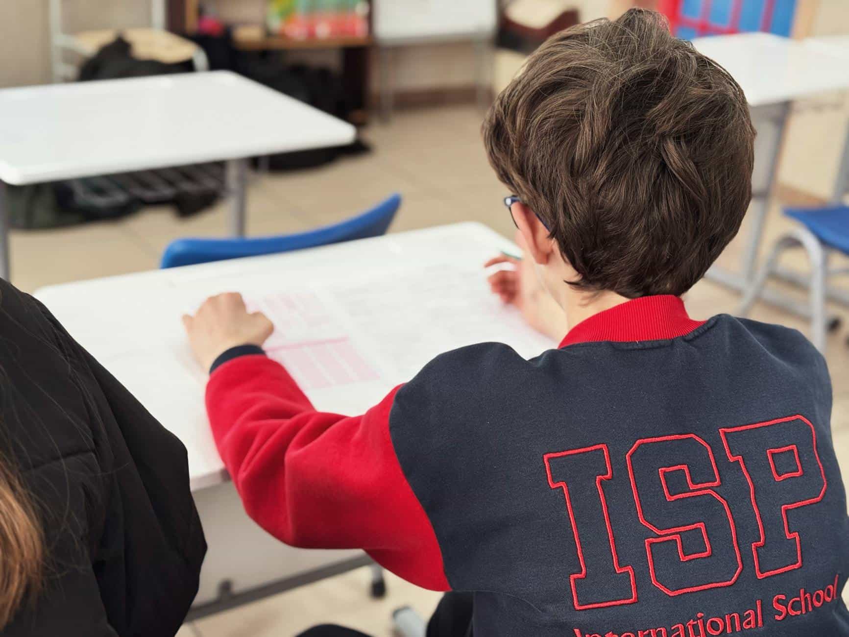 student in classroom at international school