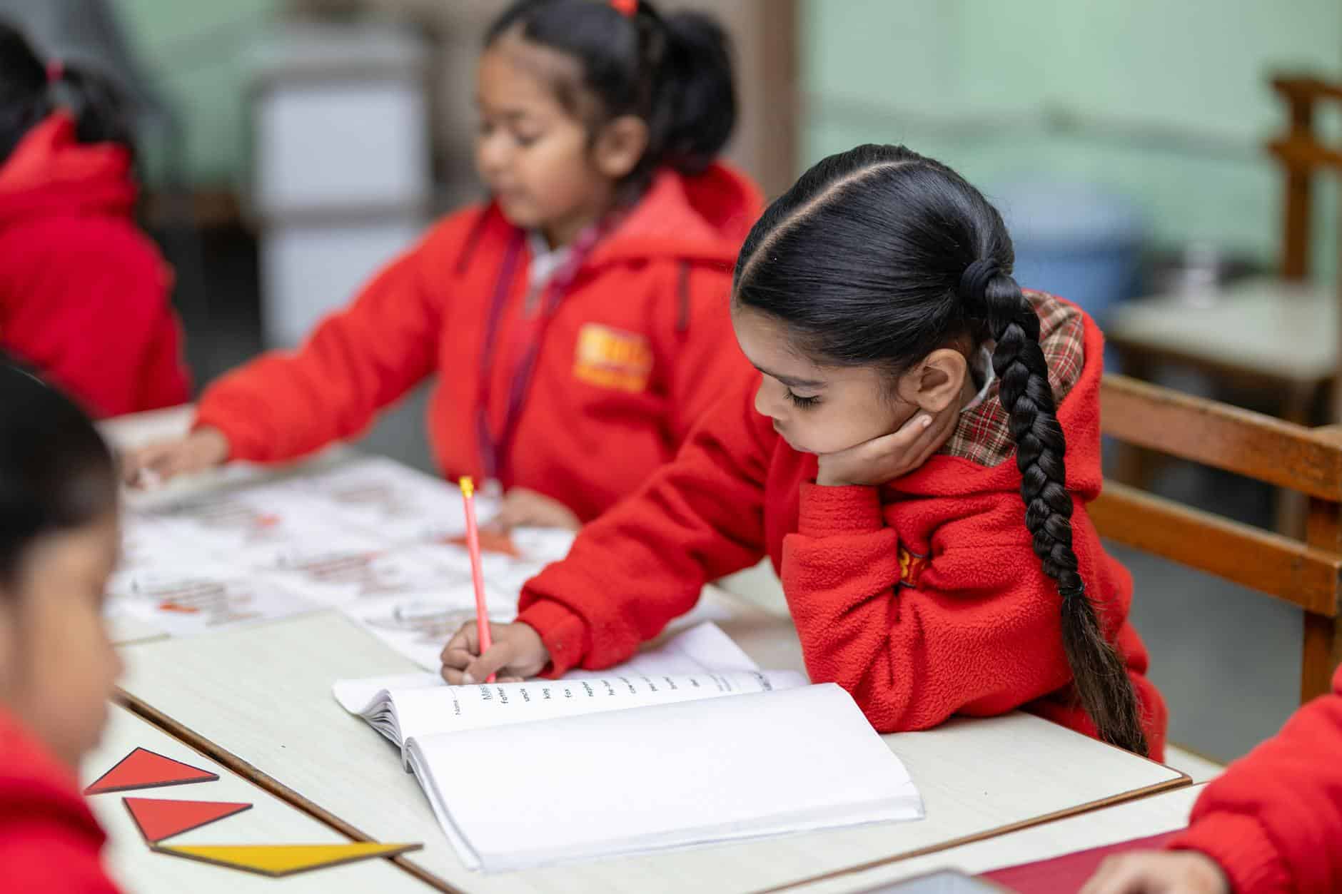 young students engaged in classroom learning