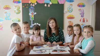 children with teacher in colorful classroom setting