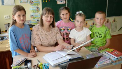 teacher and students in a classroom setting