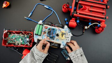 a person fixing a toy car