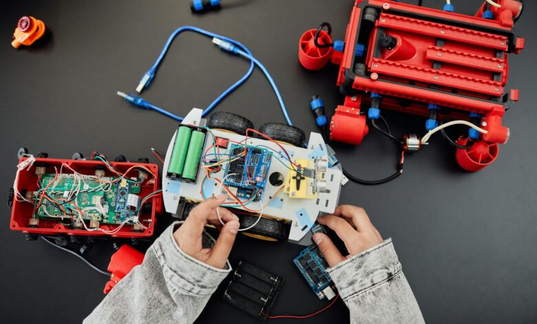 a person fixing a toy car