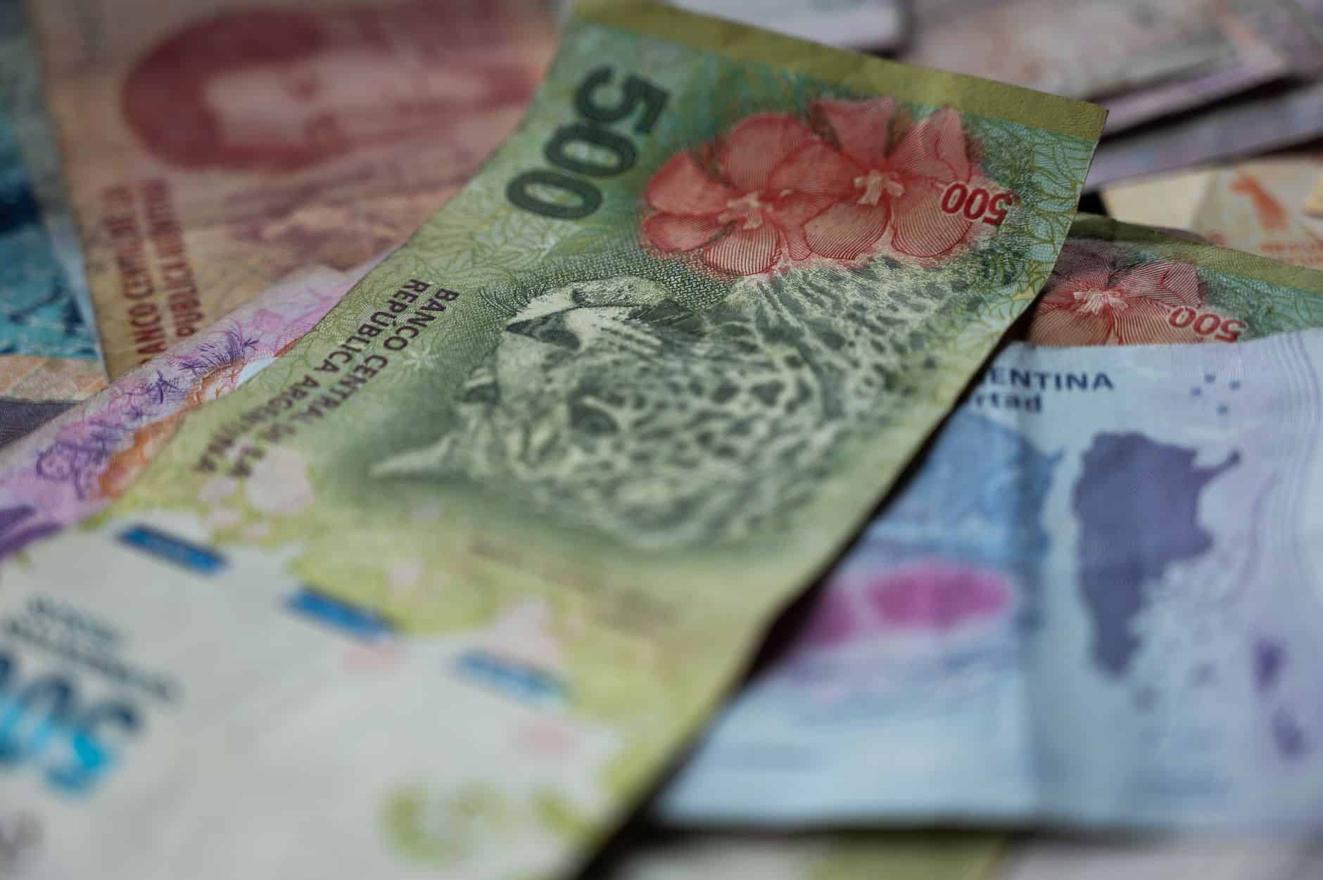 close up of argentine pesos with wildlife imagery