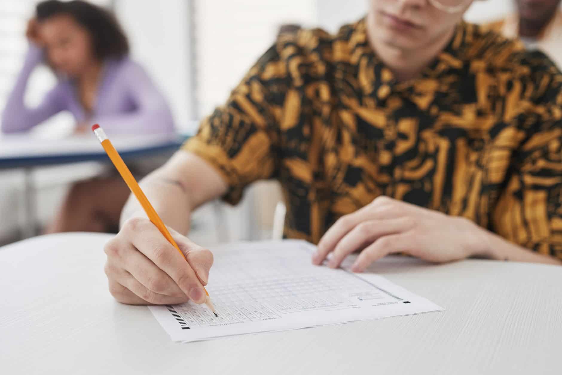 a person holding a pencil