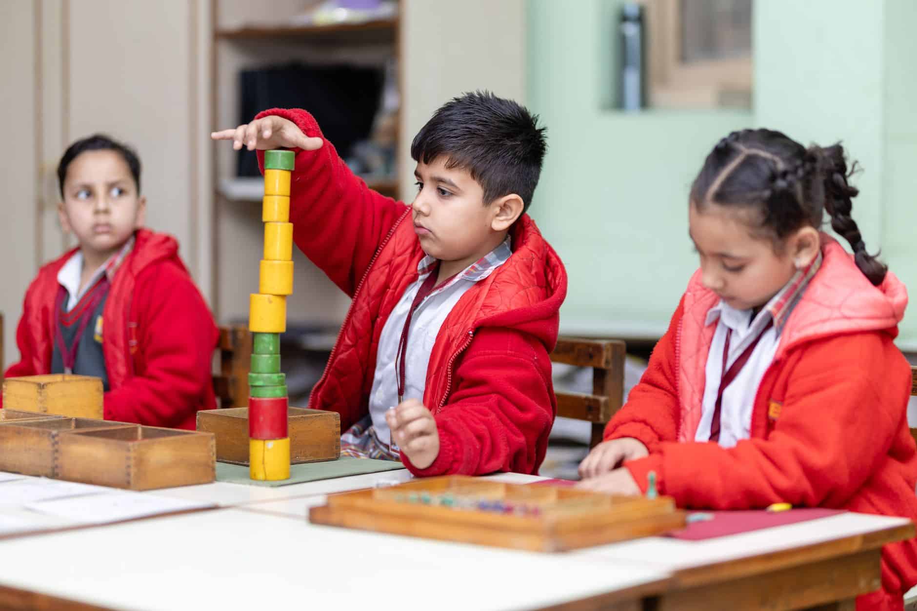young students engaging in montessori activity